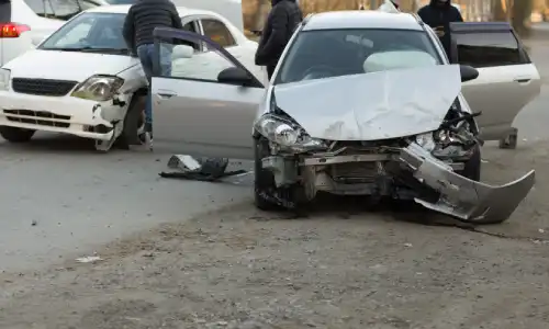 Accident victims stepping out of their vehicles after a midday collision.